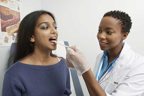 Why examining your tongue can help detect 5 oral health issues
