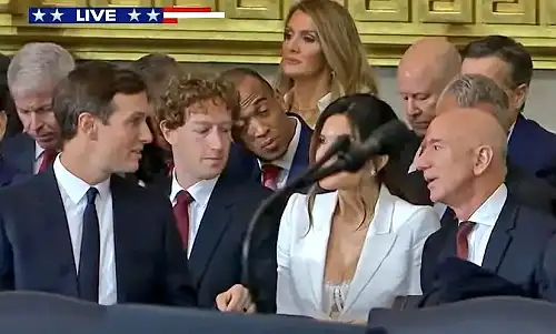 'Is That a Bra?': Mark Zuckerberg Caught 'Sneaking a Peek' at Jeff Bezos' Fianceé as She Slips Into 'Blow-Up Doll' Attire for Donald Trump's Inauguration