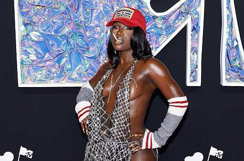 Women's History Month Spotlight: How Doechii Became A Dynamic Force In Music & Pop Culture [Gallery]