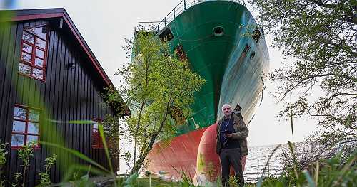 A 440-foot ship nearly hit a Norway cabin as its owner slept. The helmsman was reportedly asleep too.