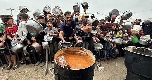 Controversial Gaza aid group pauses operations after reports of deaths, violence