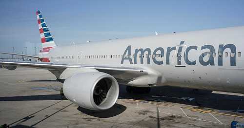 Passenger accused of dragging American Airlines flight attendant and shouting "you