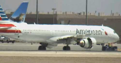 American Airlines flight makes emergency landing as flames, smoke shoot from engine