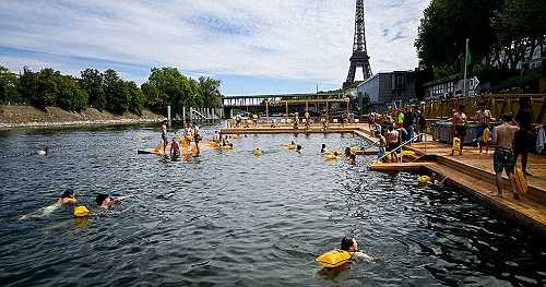 Parisians take a plunge in the Seine River after century-long ban