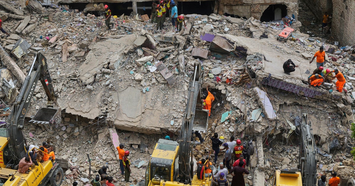 Building collapse in Pakistan kills at least 16 as search and rescue operations continue