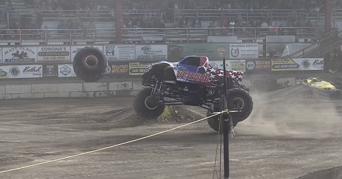 Video shows monster truck wheel fly off mid-performance, damaging multiple cars
