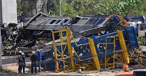 Crane falls onto moving train in Thailand, killing at least 30 in fiery derailment