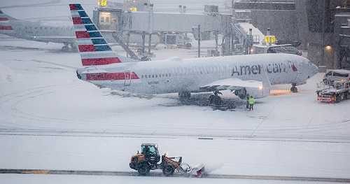 Flight cancellations pile up across the country amid major winter storms