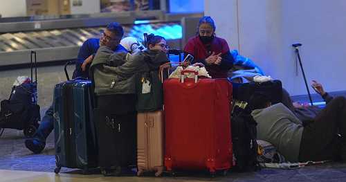 Travelers stuck as winter storm forces thousands of flight cancellations