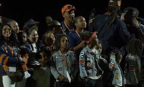 CAM NEWTON CELEBRATES JERSEY RETIREMENT WITH HIS KIDS BY HIS SIDE