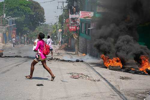 Shot But Unshaken: Photojournalist Dieu-Nalio Chery Risks His Life Documenting Haiti’s Unrest