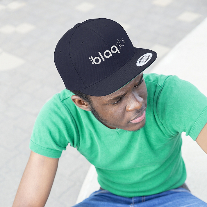 Support Blaqsbi by purchasing this item. The proceeds to this purchase will help us keep the platform running and provide funding for future improvements.This Yupoong 6-panel cap is a modern take on a classic design. This hat is the perfect choice thanks to its sharp styling, spirited color and lively green underbill. The old-school snapback closure and iconic flat bill add a subtle charm that takes you back to the good ol’ days..: 80% Acrylic 20% Wool.: Green underbill.: 7-position adjustable snap closure.: Structured and high profile silhouette