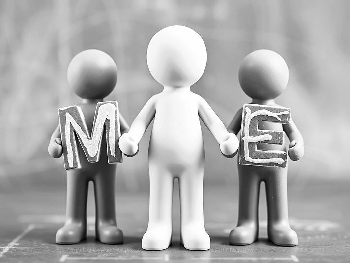 The photograph presents a meticulously composed tableau of three humanoid figures rendered in a...